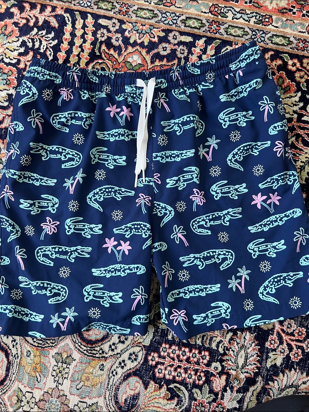 chubbies navy and pink tropical alligator neon swim trunks
